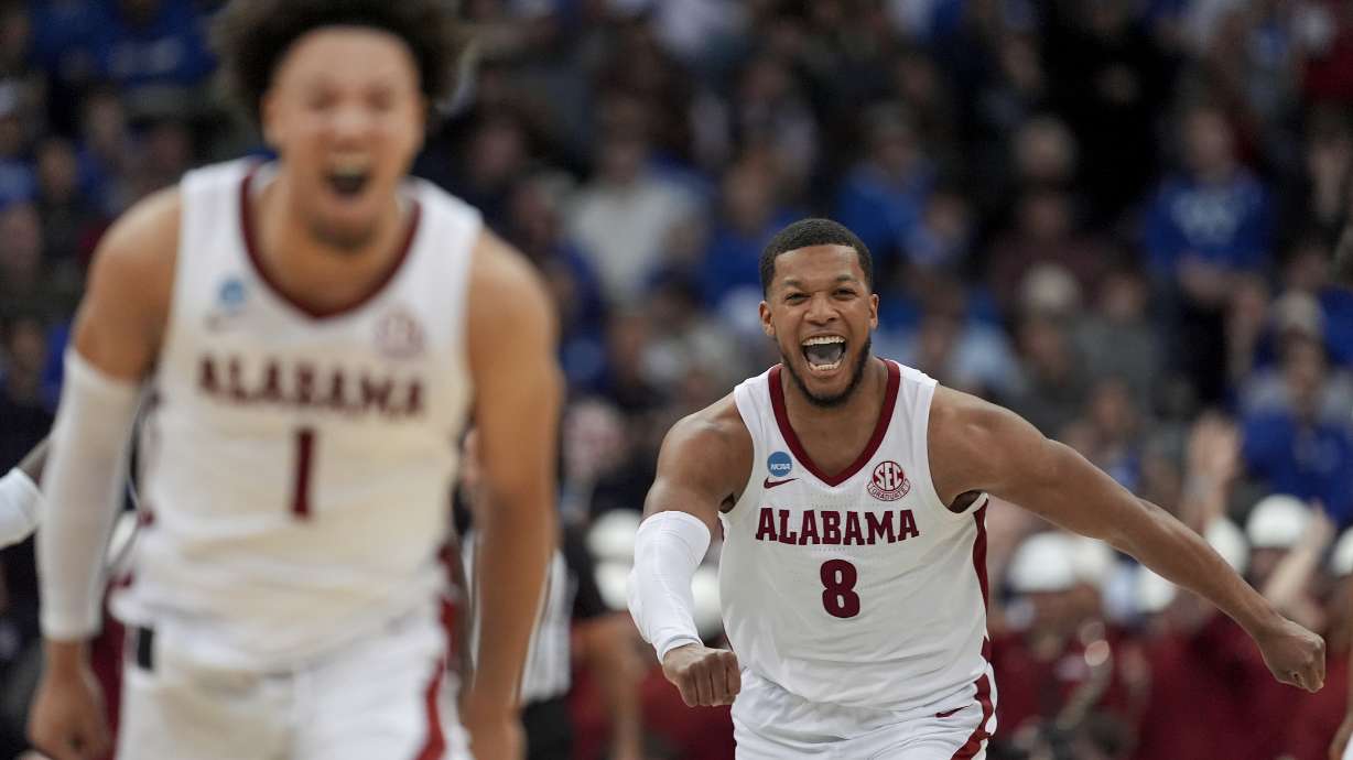 Alabama guard Chris Youngblood (8) and guard Mark Sears (1) react during the second half of a Sweet 16 round NCAA college basketball tournament game against Brigham Young, Thursday, March 27, 2025, in Newark, N.J.