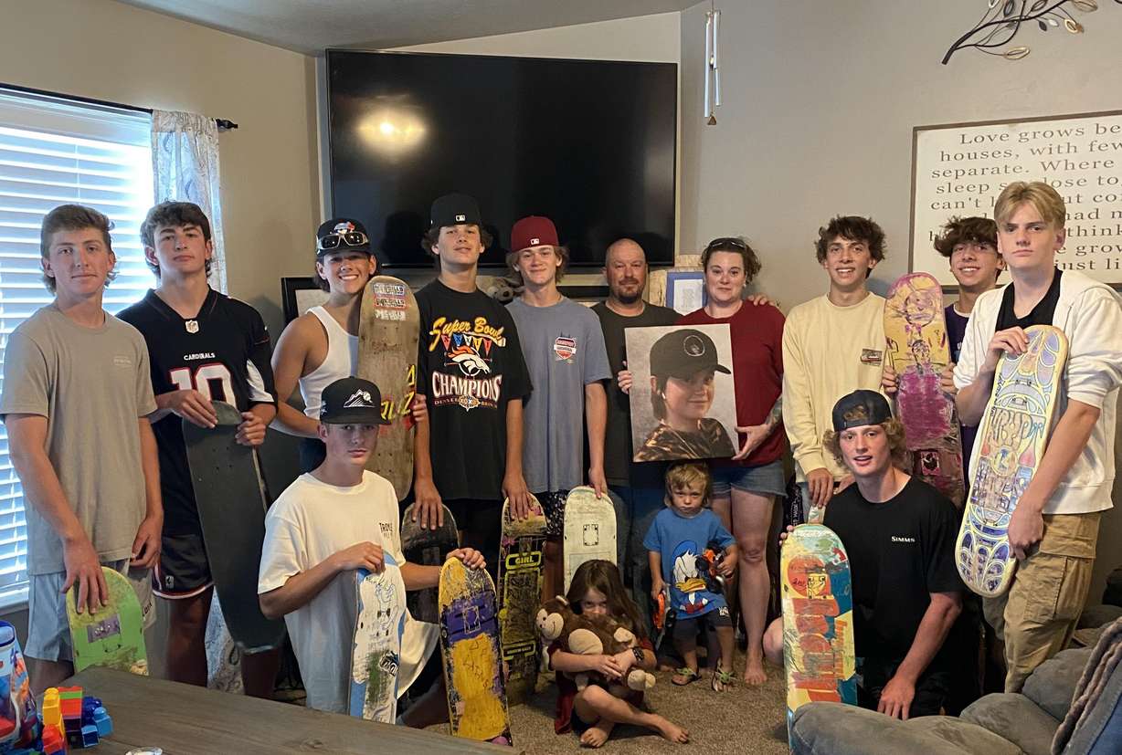 Friends of Mason Jacobson show off their skateboards they are donating for benches in their friend's honor.