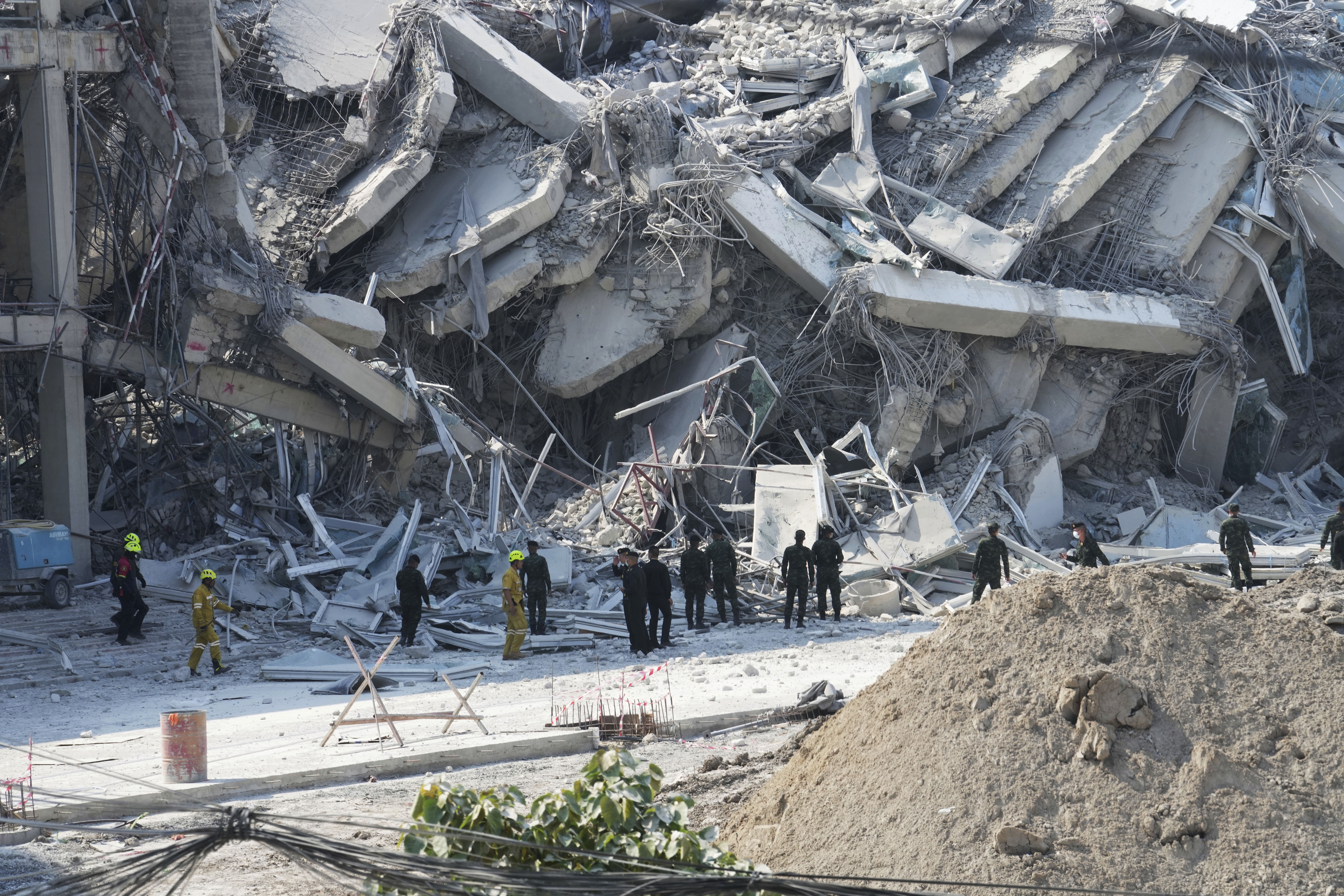 Rescuers work at the site of a high-rise building under construction that collapsed after a 7.7 magnitude earthquake in Bangkok, Thailand, Friday.