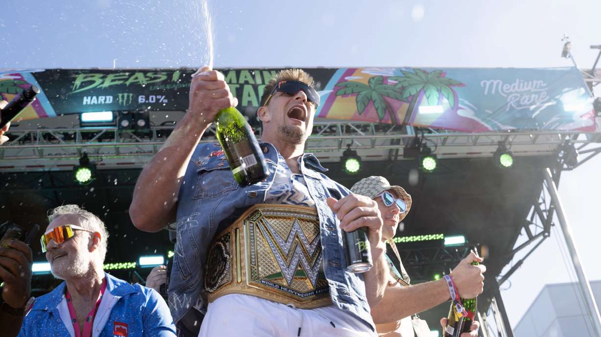 FILE 0-Rob Gronkowski, wearing a wrestling championship belt, makes an appearance at Gronk Beach music festival during Super Bowl week on Saturday, Feb. 11, 2023, at Talking Stick Resort in Scottsdale, Ariz.