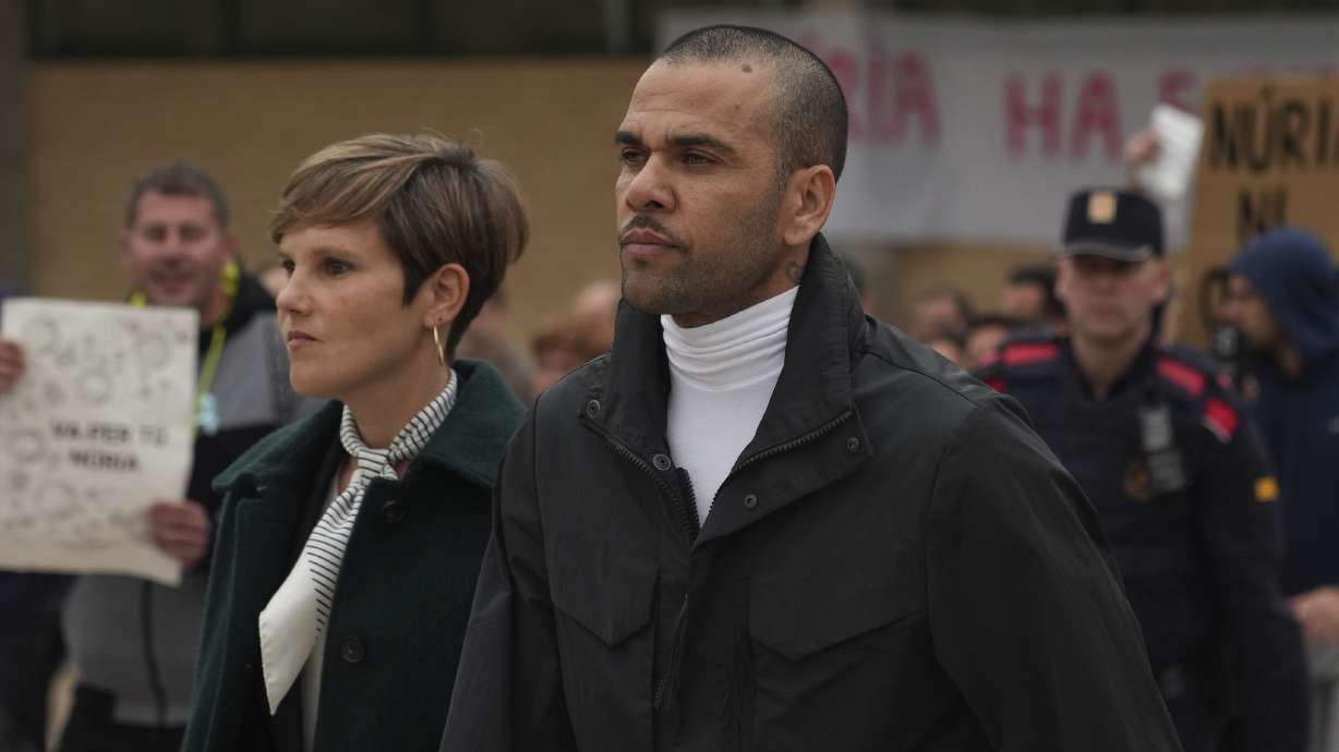 FILE - Brazilian soccer star Dani Alves, right, leaves Brians 2 penitentiary center in Sant Esteve Sesrovires, near Barcelona, northeast, Spain, Monday, March 25, 2024.
