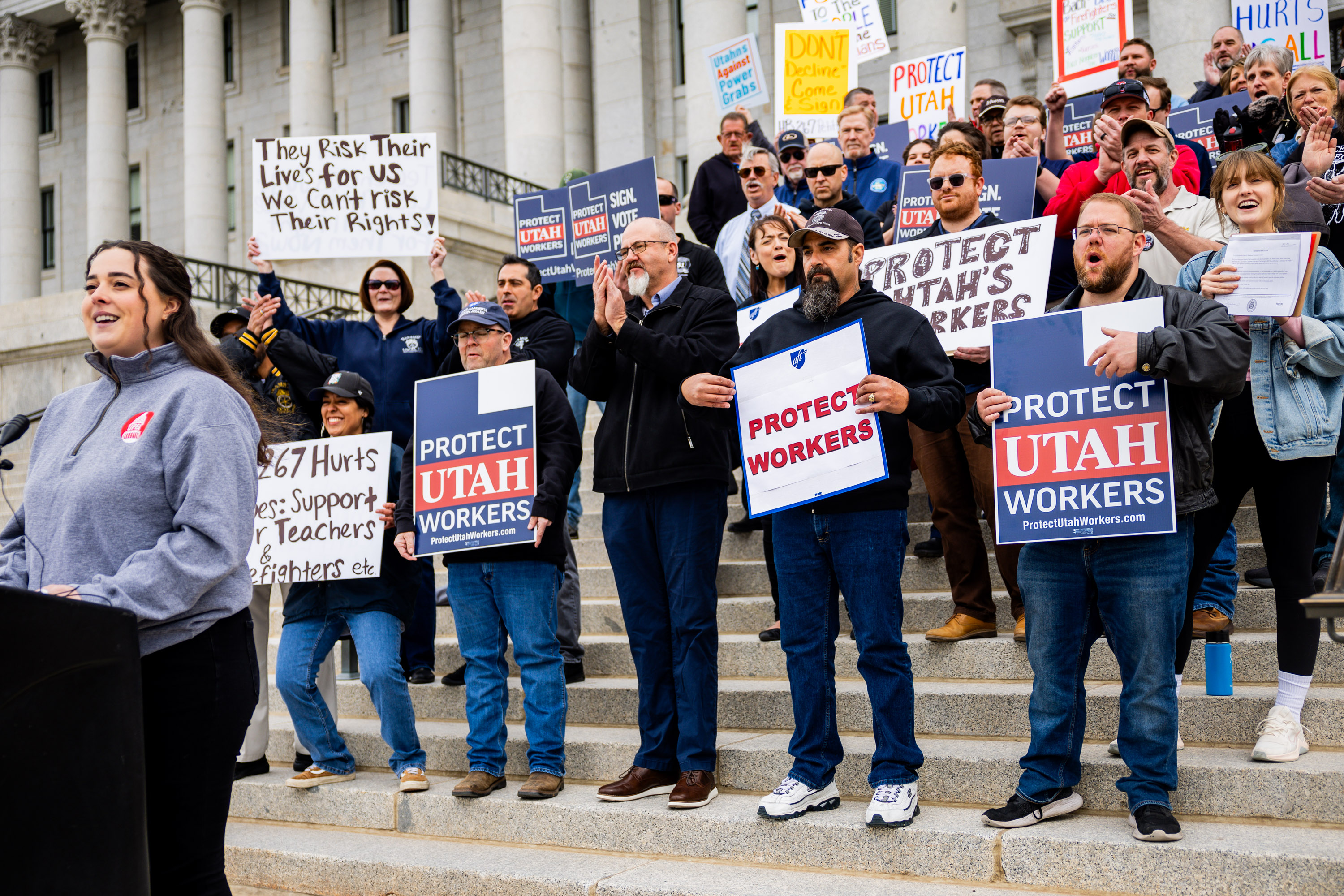 Jessica Bruner, director of the Utah Public Employees Association, left, announces an initial signature count gathered in the first two weeks of the HB267 referendum campaign at the state Capitol in Salt Lake City on Friday.