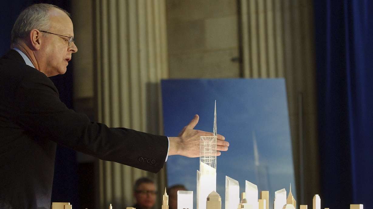 Architect David Childs puts his hand behind the top of the design for the Freedom Tower to be built on the World Trade Center in New York City on Dec. 19, 2003. Childs died on Wednesday from Lewy body dementia; he was 83.