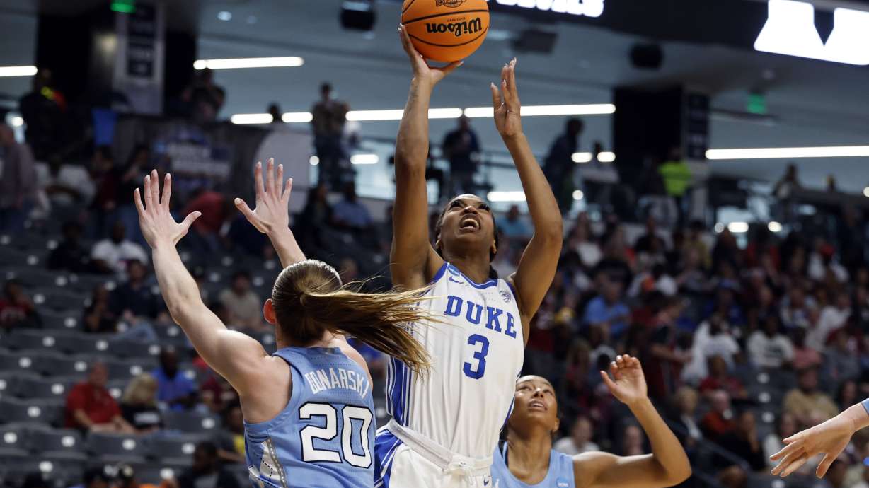 Duke guard Ashlon Jackson (3) puts up a shot over North Carolina guard Lexi Donarski (20) during the first half in the Sweet 16 of the NCAA college basketball tournament, Friday, March 28, 2025, in Birmingham, Ala.