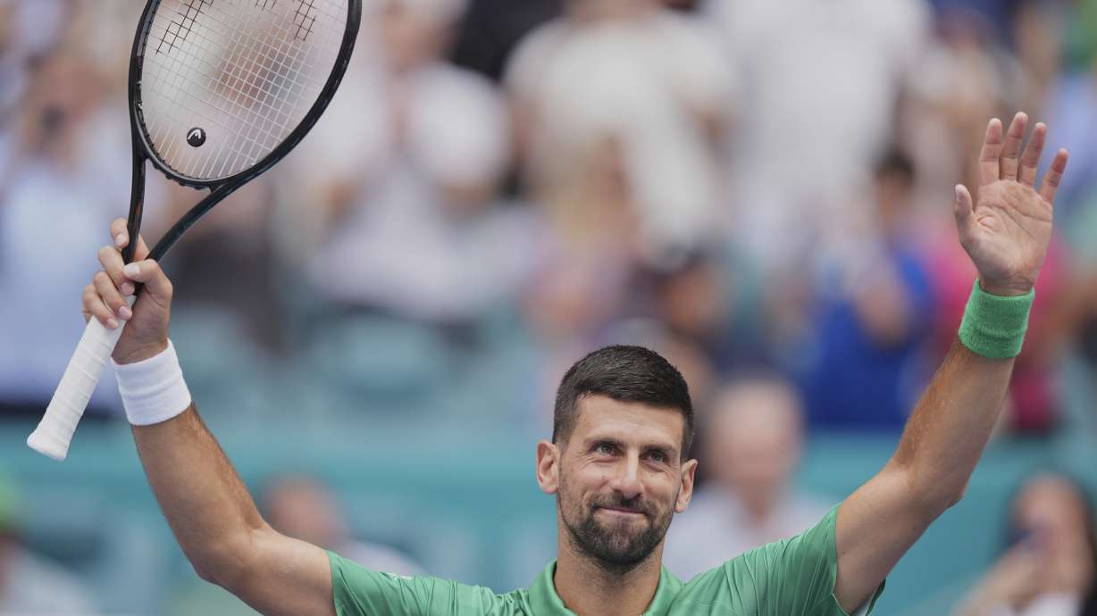 Novak Djokovic, of Serbia, salutes the crowd after winning his semifinal match against Grigor Dimitrov, of Bulgaria, at the Miami Open tennis tournament, Friday, March 28, 2025, in Miami Gardens, Fla.