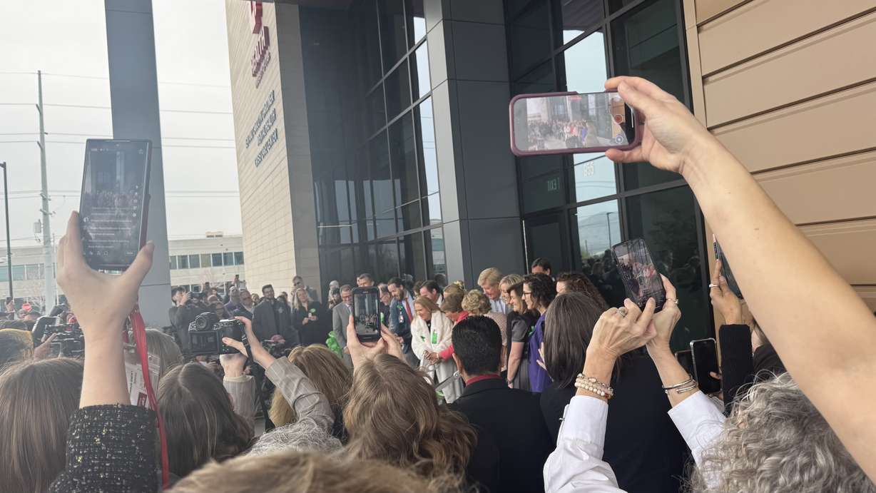 Crowds watch as a ribbon is cut at the Kem and Carolyn Gardner Mental Health Crisis Care Center in South Salt Lake on Friday. The facility will provide 24/7 emergency mental health care.