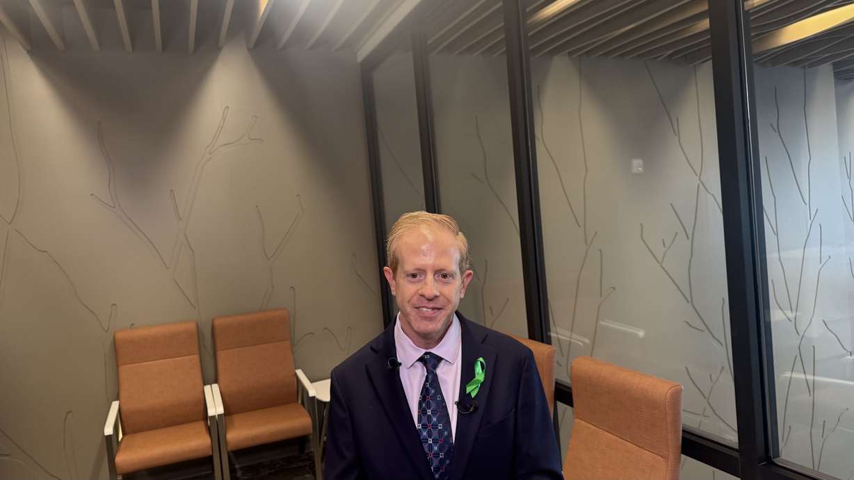 Russell Belt speaks with media after the ribbon-cutting ceremony for the Kem and Carolyn Gardner Mental Health Crisis Care Center in South Salt Lake on Friday.