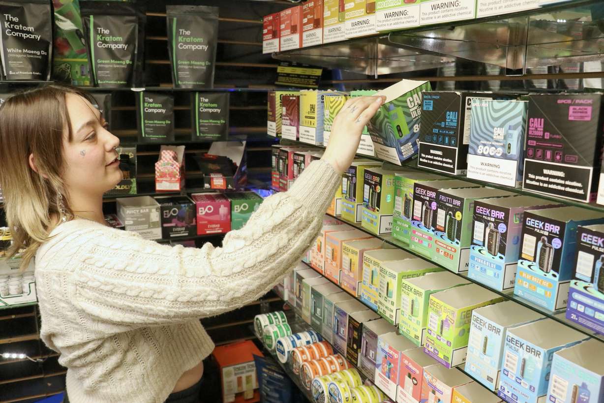 Val, a manager at downtown Salt Lake City's Vape on Main, manages inventory returns of flavored vape cartridges Thursday after a ban on the product went into enforcement following a federal court ruling on Monday.