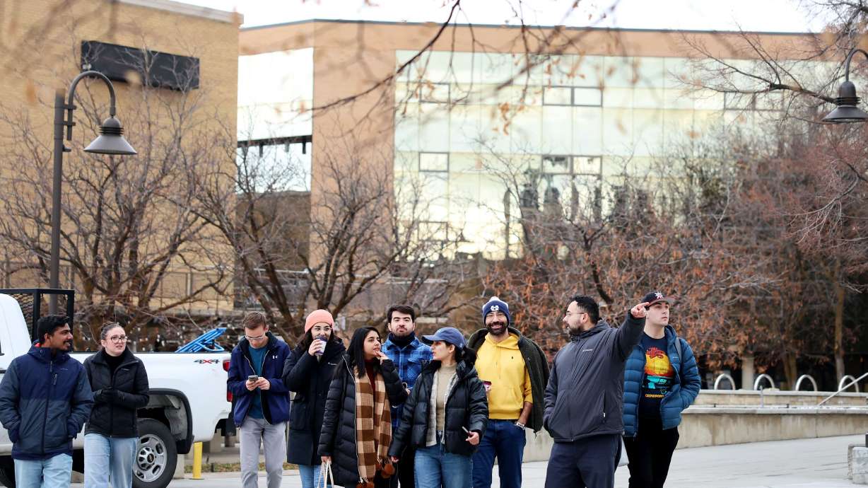 Students walk on the campus of Utah State University in Logan on Jan. 17. Utah Gov. Spencer Cox signed into law HB265 — the "strategic reinvestment" legislation requiring the state's public colleges and universities to reallocate millions of dollars.