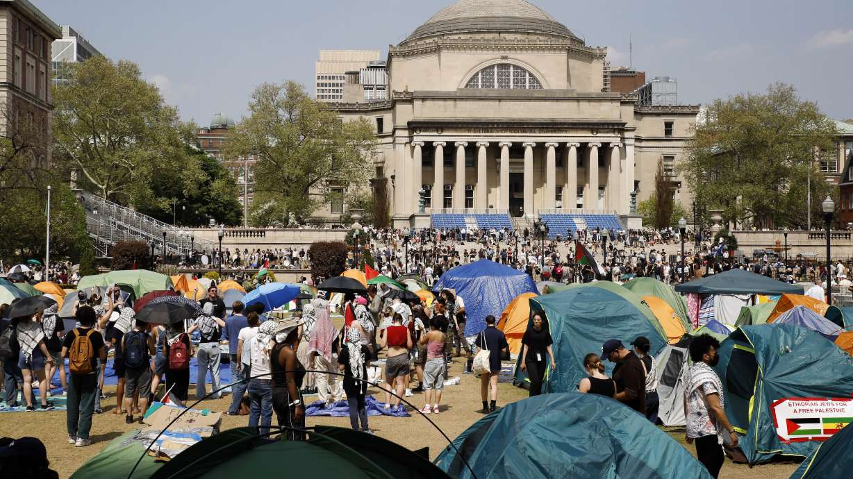 Student protesters gather inside their encampment on the Columbia University campus, April 29, 2024, in New York. The university's interim president resigned Friday to return to running the medical center.