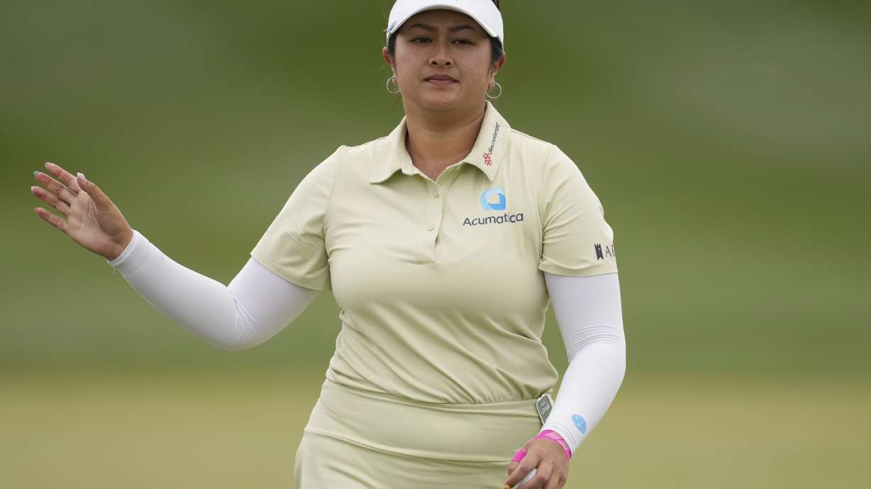Lilia Vu waves on the seventh green during the second round of the Ford Championship LPGA golf event, Friday, March 28, 2025, in Phoenix.