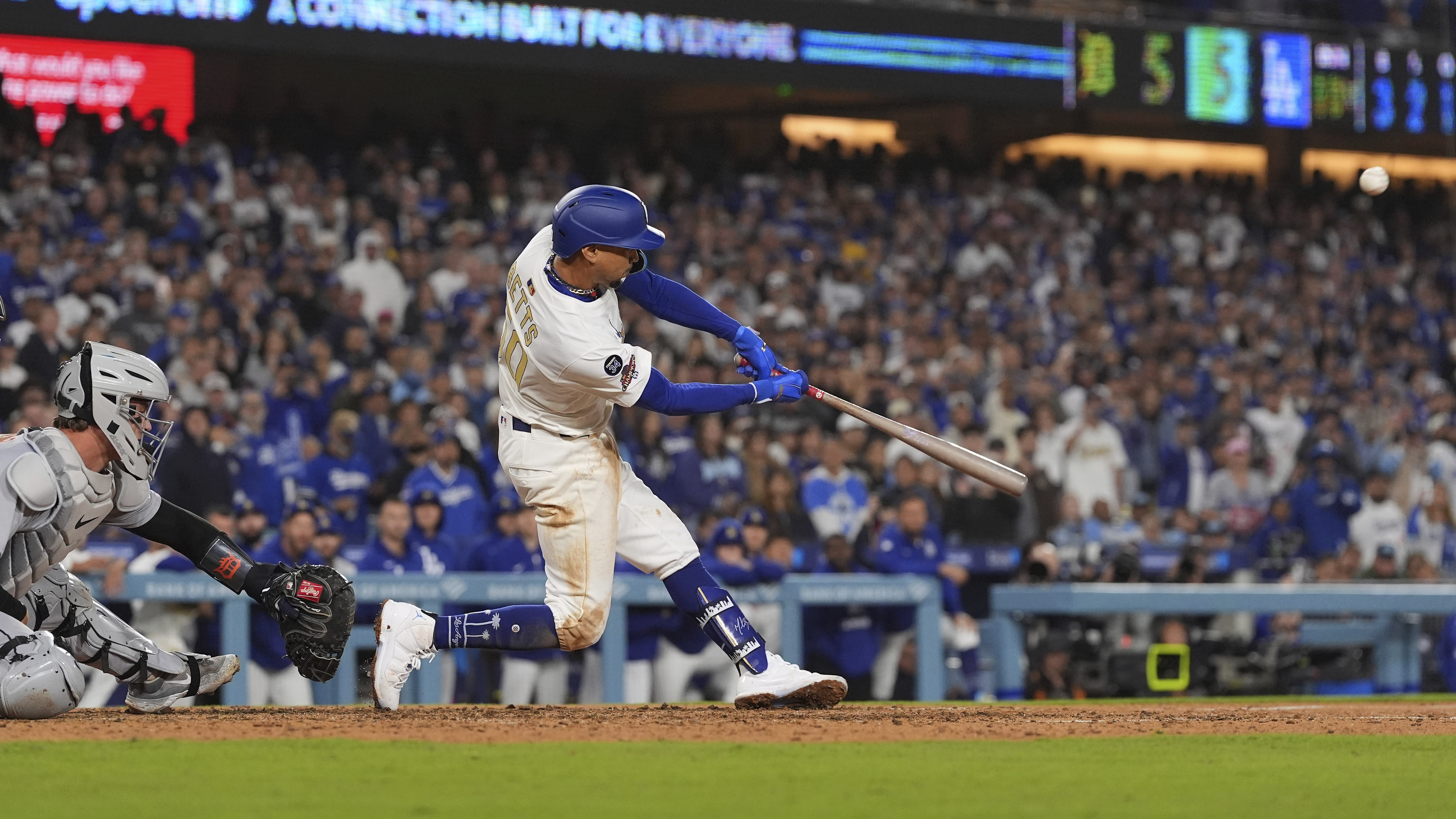 Los Angeles Dodgers' Mookie Betts hits a walk-off three-run home run as Detroit Tigers catcher Dillon Dingler watches during the 10th inning of a baseball game Friday, March 28, 2025, in Los Angeles.