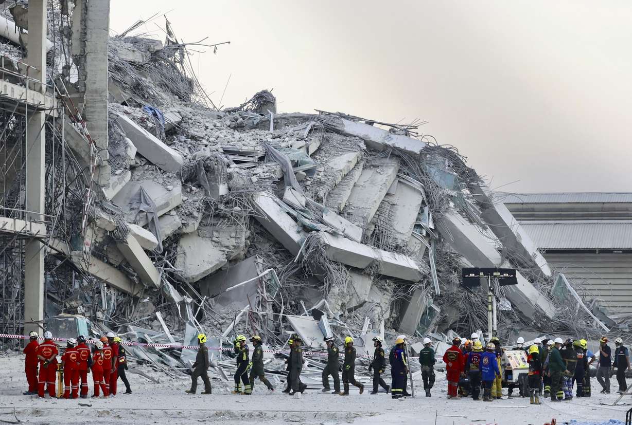 Rescuers work at the site of a high-rise building under construction that collapsed after a 7.7 magnitude earthquake in Bangkok, Thailand, Friday.