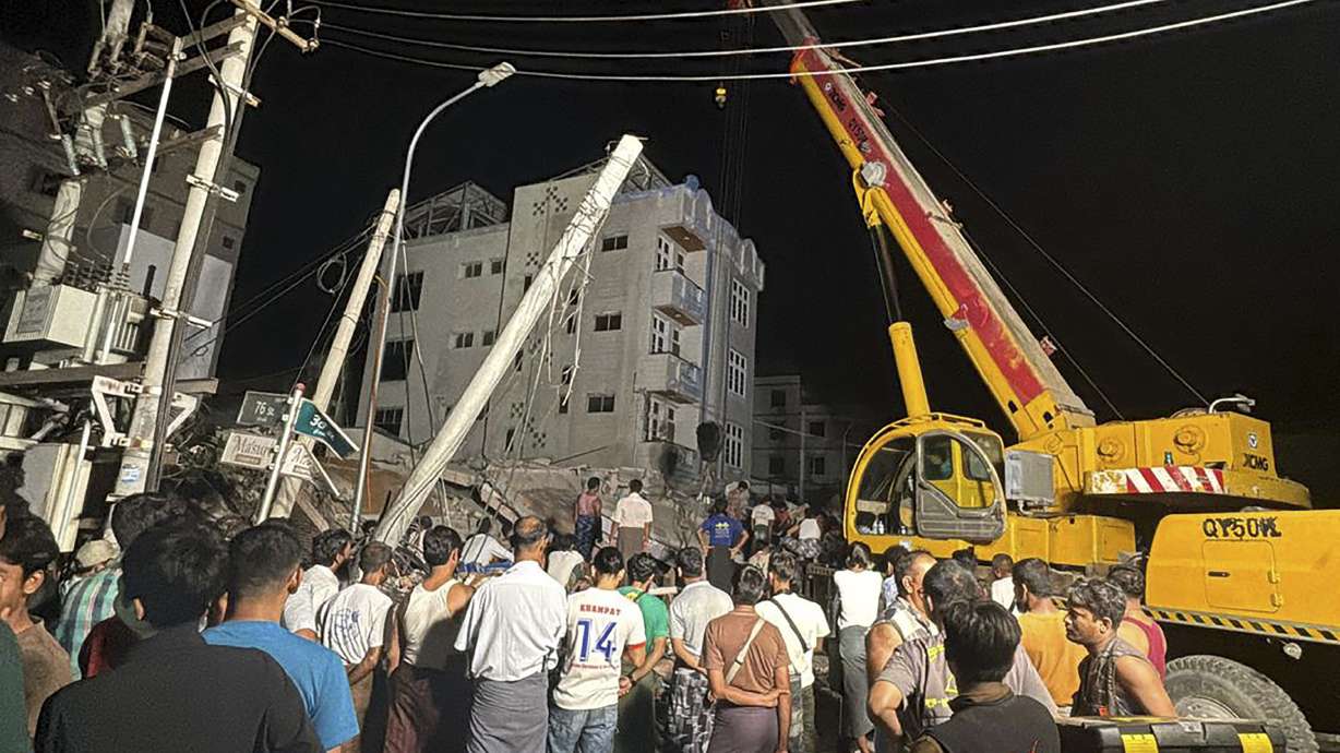 Volunteers work at an earthquake affected area in Mandalay, central Myanmar, Saturday. A unilateral partial ceasefire to facilitate earthquake relief efforts has been announced by Myanmar's shadow National Unity Government as the country's death toll from the disaster soared to 1,644.