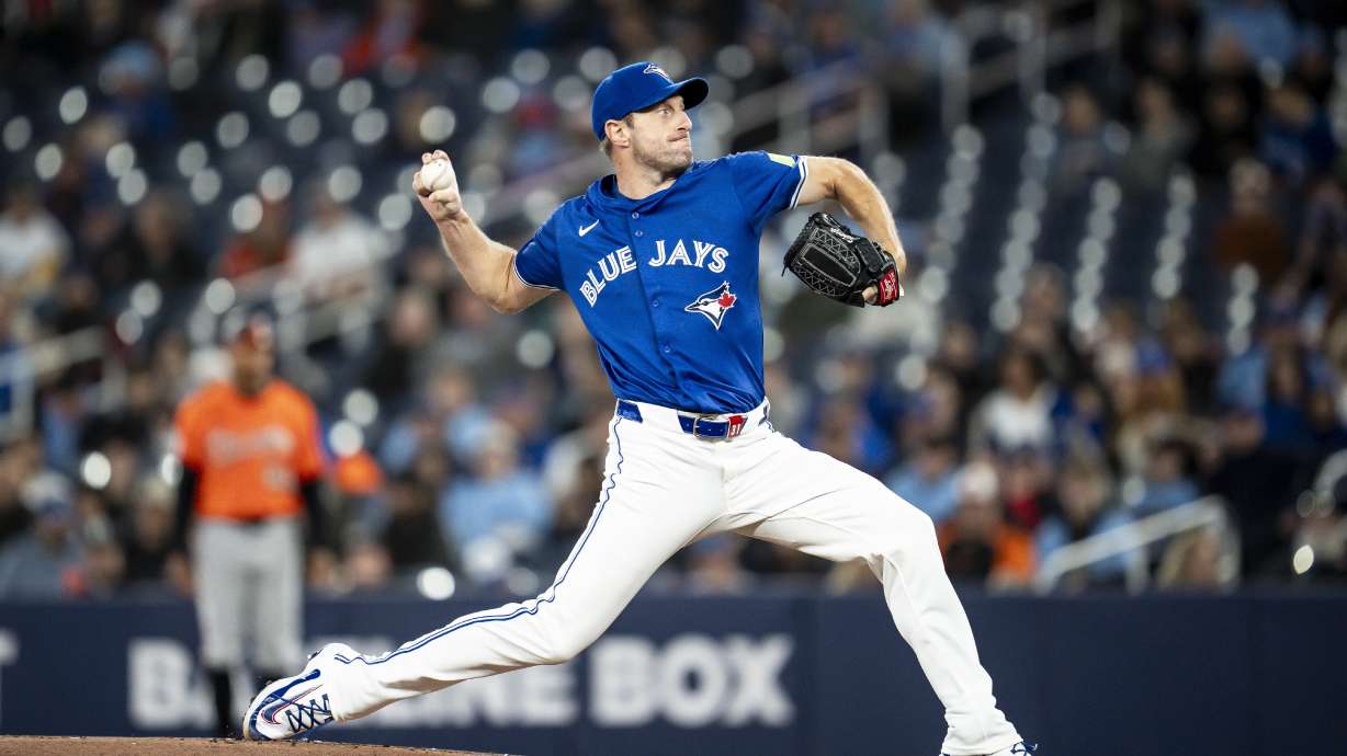 Toronto Blue Jays pitcher Max Scherzer (31) throws during the first inning of baseball game against the Baltimore Orioles Saturday, March 29, 2025, in Toronto.