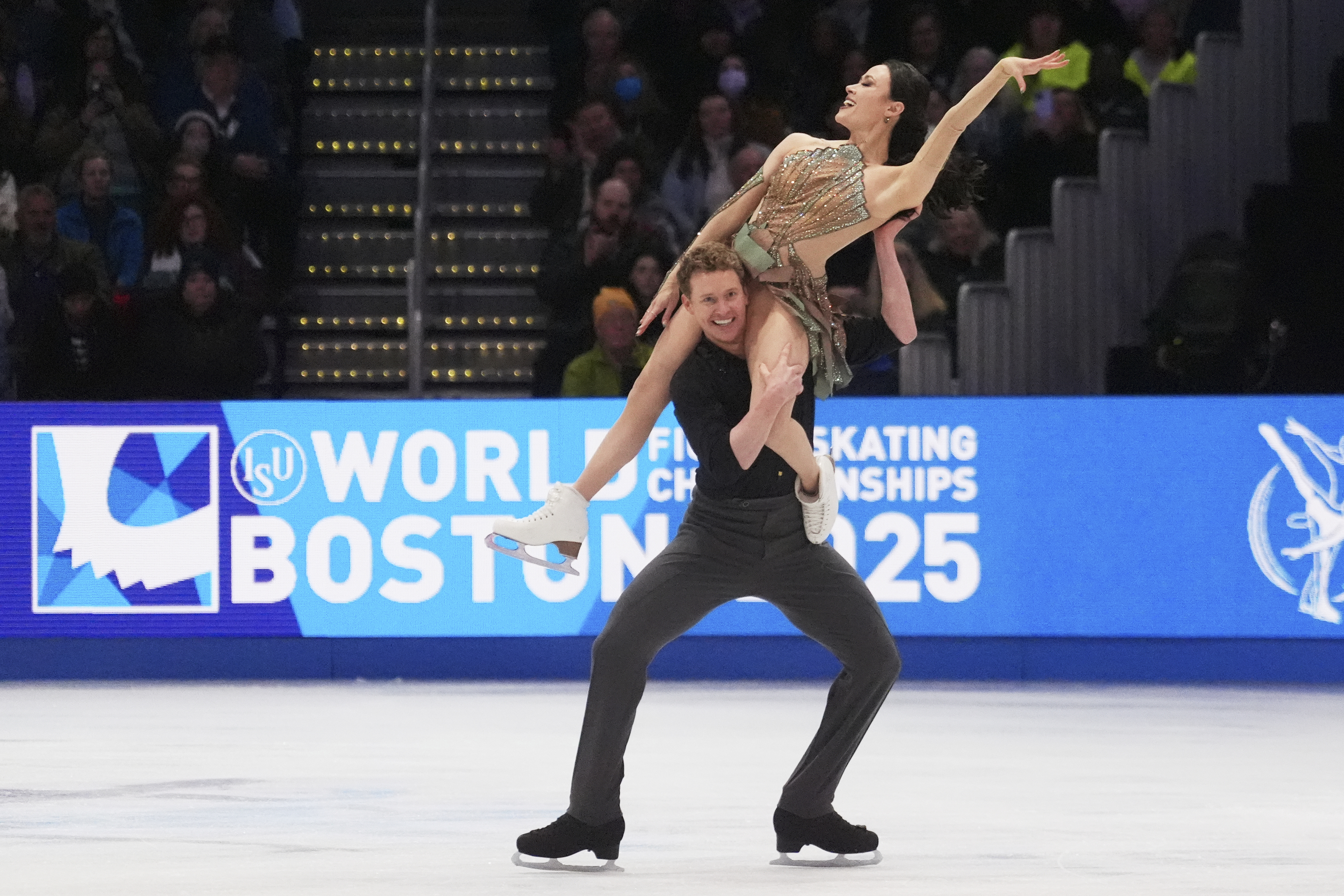 Madison Chock and Evan Bates, of the United States, perform during the ice dance free dance program at the figure skating world championships, Saturday, March 29, 2025, in Boston.