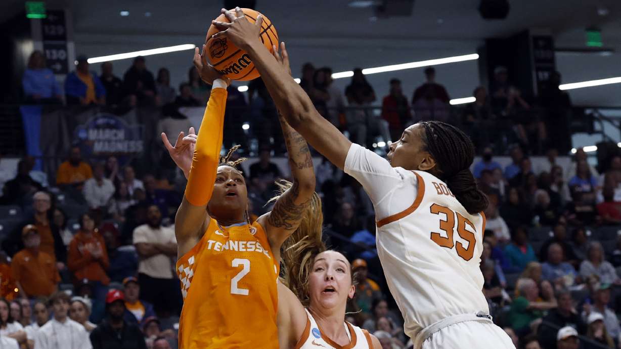 Texas forward Madison Booker (35) blocks the shot attempt of Tennessee guard Ruby Whitehorn (2) during the first half in the Sweet 16 of the NCAA college basketball tournament, Saturday, March 29, 2025, in Birmingham, Ala.