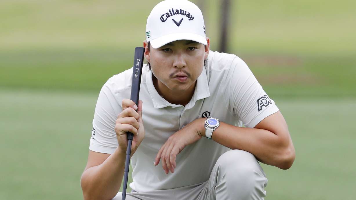 Min Woo Lee looks over the eighth green before putting in the first round of the Houston Open golf tournament, Thursday, March 27, 2025, in Houston.