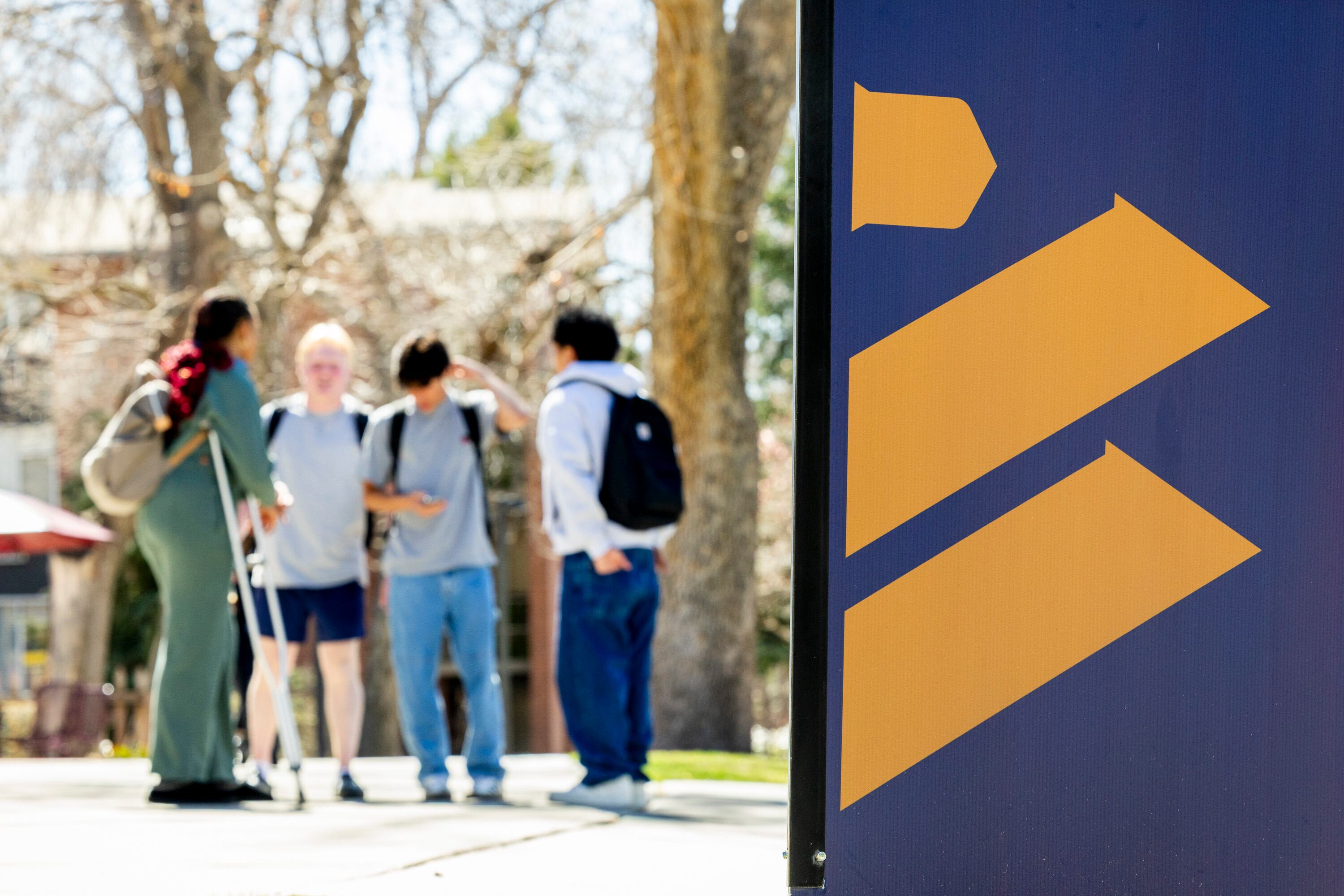 Students gather on the campus of Westminster University in Salt Lake City on March 26.