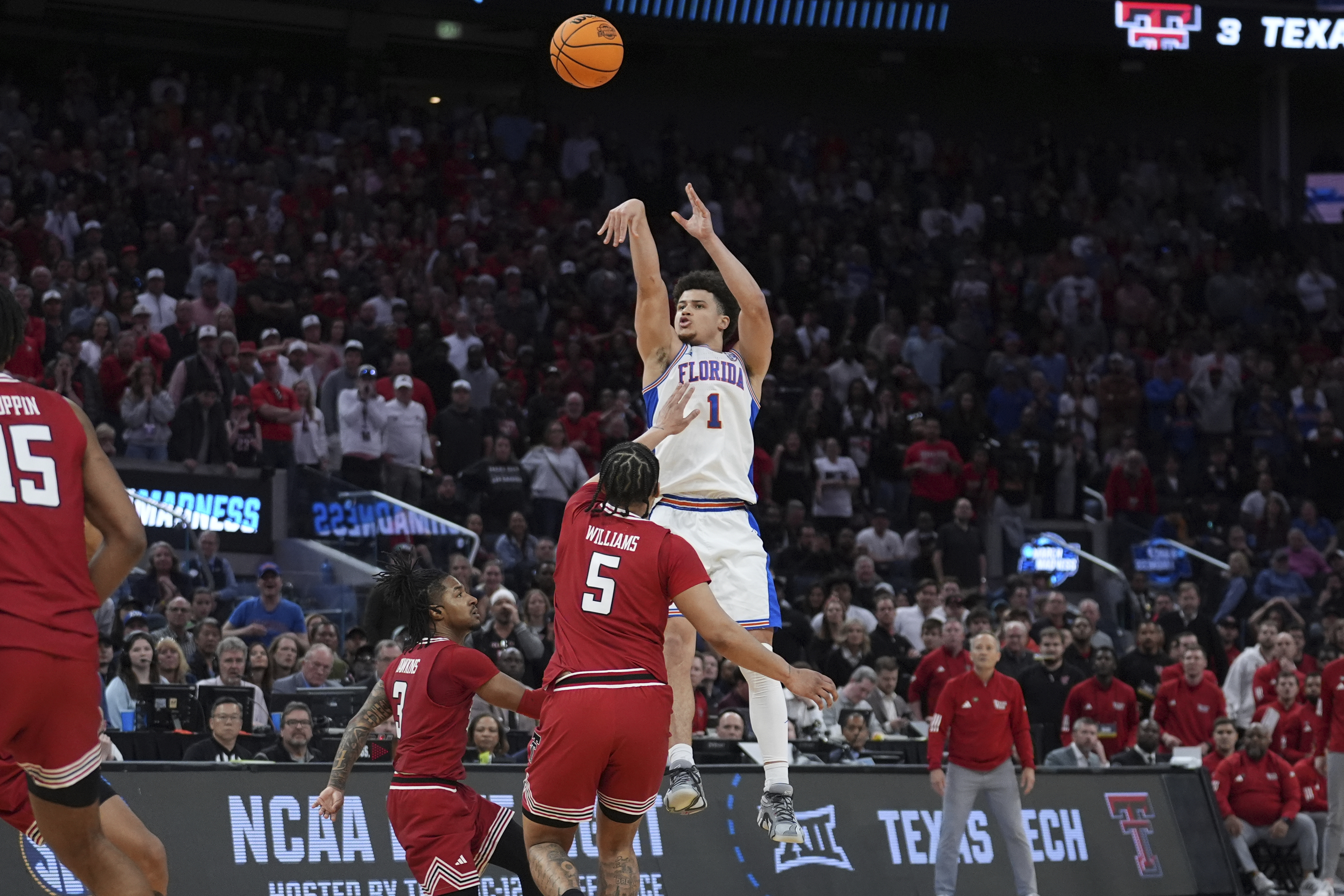 Florida guard Walter Clayton Jr. (1) shoots a three pointer over Texas Tech forward Darrion Williams (5) during the second half in the Elite Eight of the NCAA college basketball tournament, Saturday, March 29, 2025, in San Francisco.