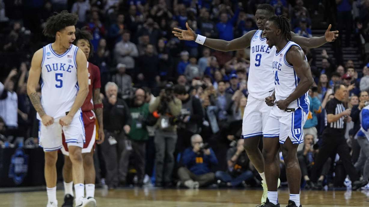 Duke guard Tyrese Proctor (5), guard Sion James (14) and Duke center Khaman Maluach (9) react as time winds off the clock to end an Elite Eight round NCAA college basketball tournament game against Alabama, Saturday, March 29, 2025, in Newark, N.J.
