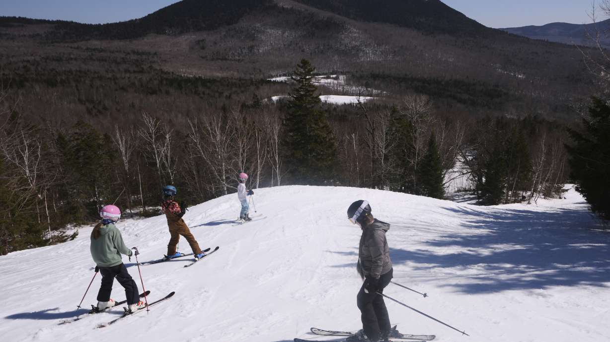 Skiers head down a trail at Black Mountain, Friday, March 14, 2025, in Jackson, N.H.