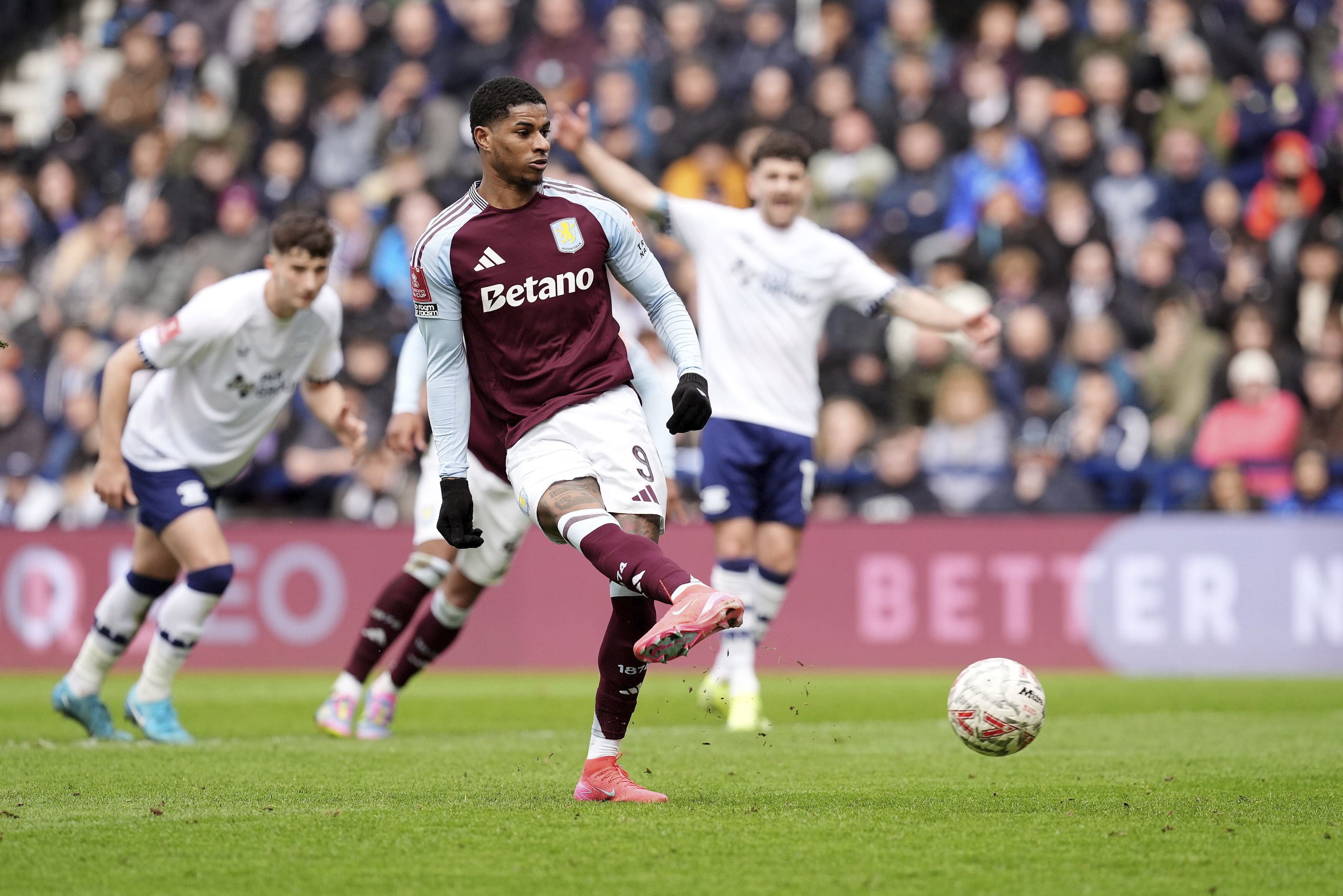 Aston Villa's Marcus Rashford scores their side's second goal of the game from a penalty during the English FA Cup quarter final soccer match against Preston North End at Deepdale, Preston, England, Sunday, March 30, 2025.