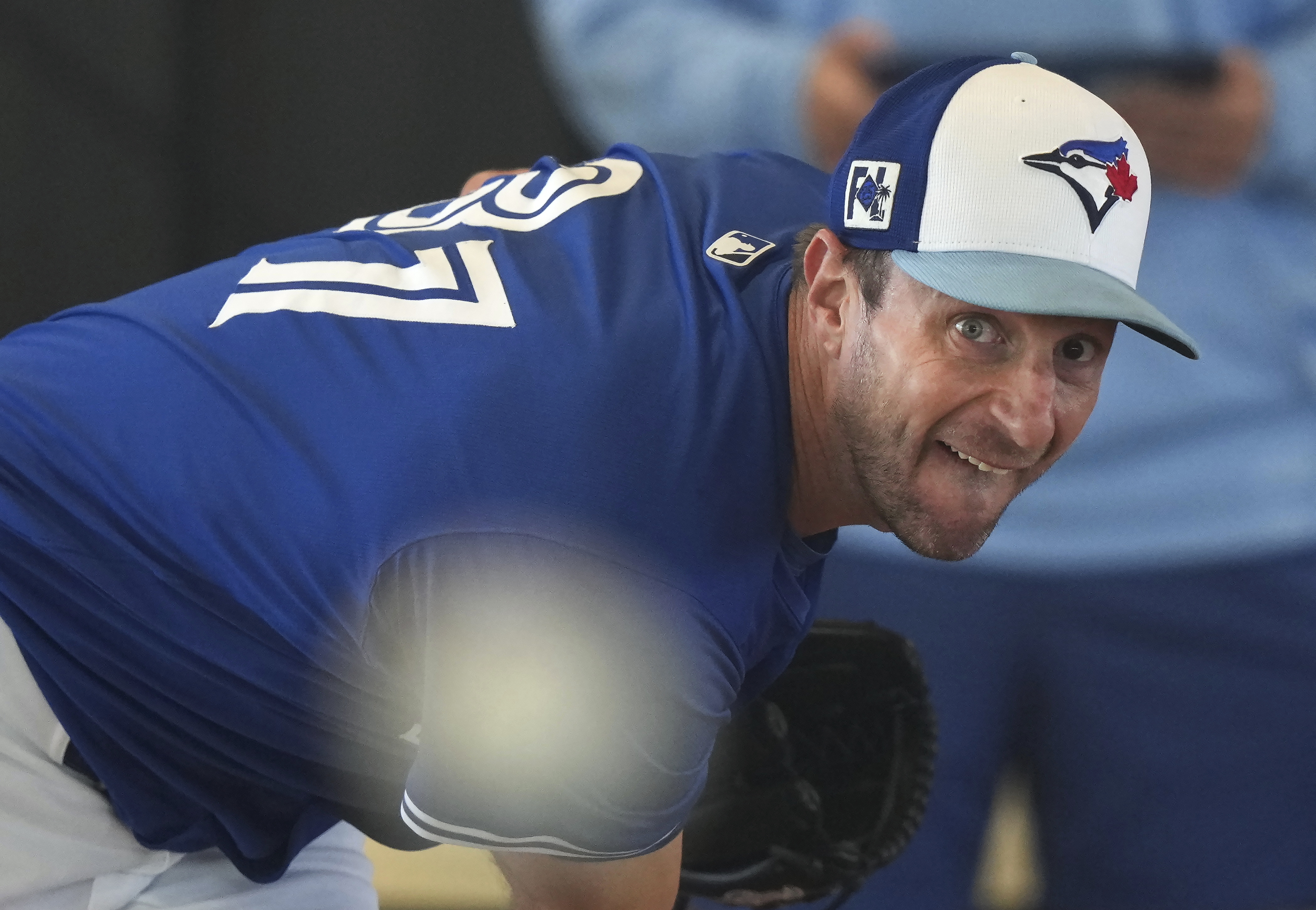 FILE - Toronto Blue Jays pitcher Max Scherzer throws a pitching session during spring training baseball in Dunedin, Fla., on Monday, Feb. 17, 2025.