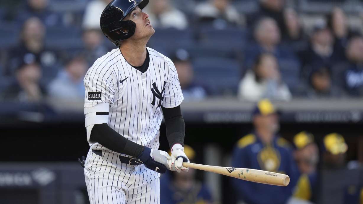 New York Yankees' Paul Goldschmidt looks up at his sacrifice fly during the seventh inning of a baseball game against the Milwaukee Brewers at Yankee Stadium, Thursday, March 27, 2025, in New York.