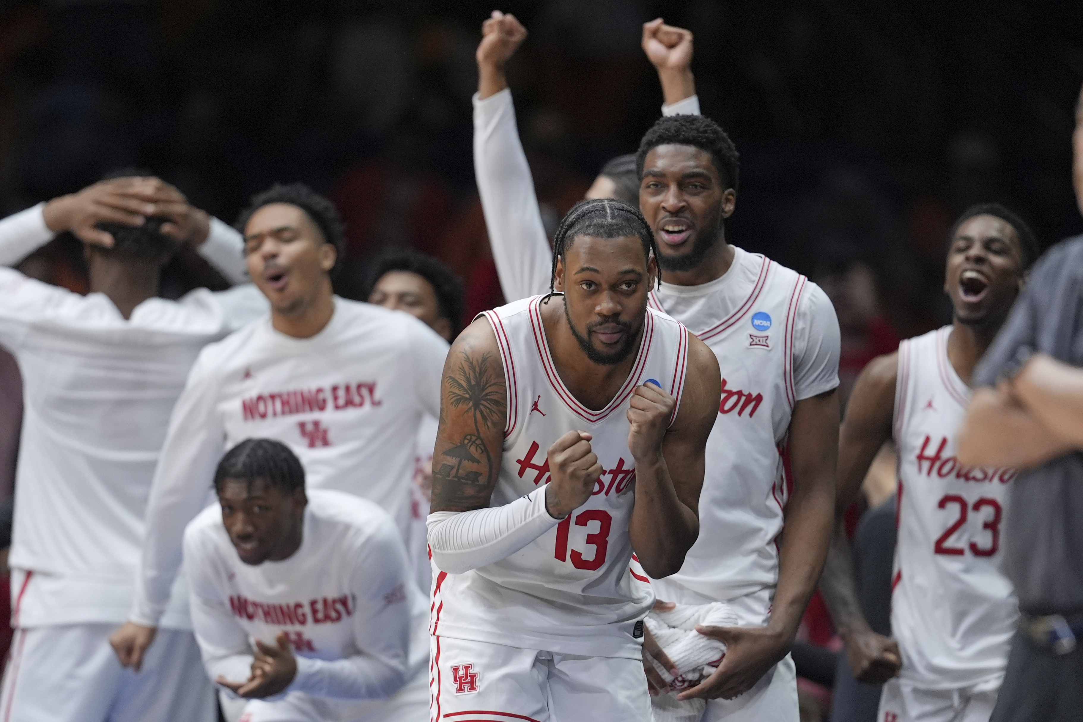 Houston's J'Wan Roberts (13) celebrates in the final minutes of the second half in the Elite Eight round of the NCAA college basketball tournament against Tennessee Sunday, March 30, 2025, in Indianapolis.
