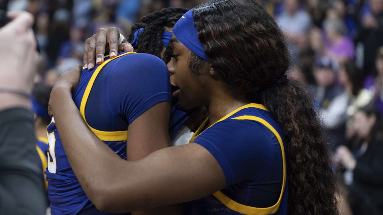 LSU forward Aneesah Morrow, right, hugs LSU forward Sa'Myah Smith after a game against UCLA in the Elite Eight of the NCAA college basketball tournament, Sunday, March 30, 2025, in Spokane, Wash.
