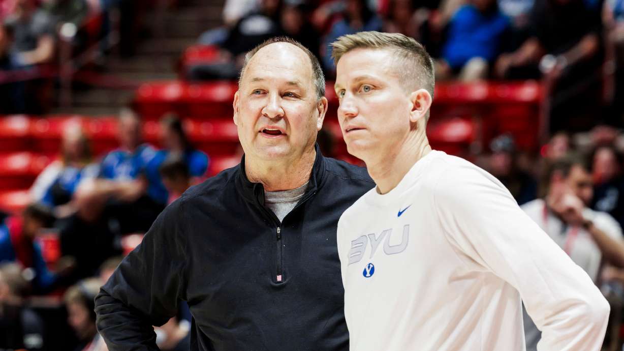 Former BYU women's basketball coach Jeff Judkins, left, with BYU associate head coach Lee Cummard before the Cougars' rivalry tilt with Utah, Jan. 25, 2025 at the Huntsman Center in Salt Lake City.