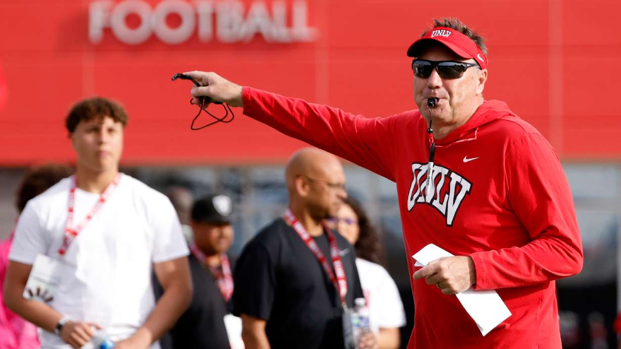 UNLV football head coach Dan Mullen blows on a whistle during a team practice in Las Vegas, Thursday, March 27, 2025.