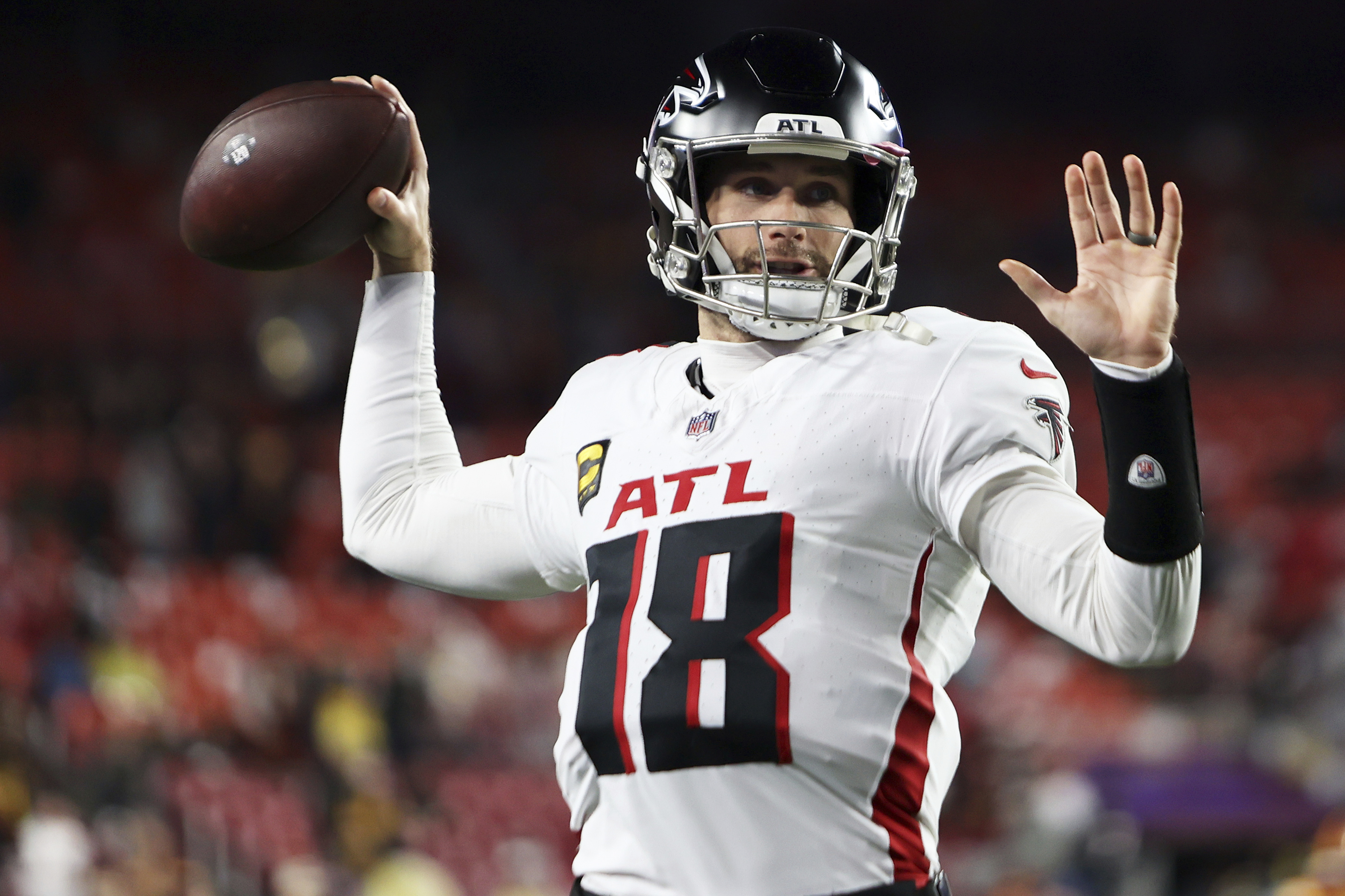 Atlanta Falcons quarterback Kirk Cousins (18) throws the ball before an NFL football game against the Washington Commanders, Sunday, Dec. 29, 2024 in Landover, Md.