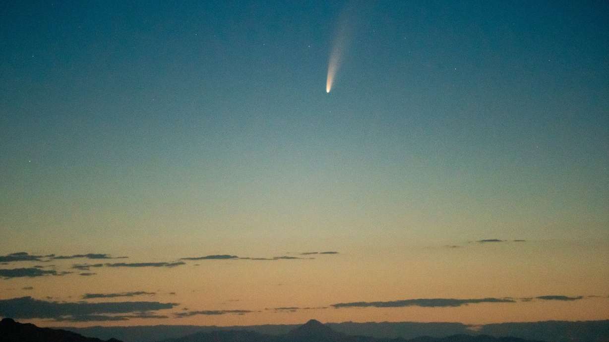 Comet C/2020 F3, also known as NEOWISE, is seen before dawn above the Bonneville Salt Flats on July 7, 2020. April is declared “Dark Sky Month,” due to the tourism benefits stargazing brings to the state.