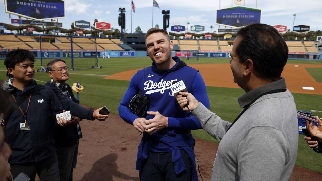 Los Angeles Dodgers' Freddie Freeman speaks to reporters during batting practice before a baseball game against the Atlanta Braves, Tuesday, April 1, 2025, in Los Angeles.