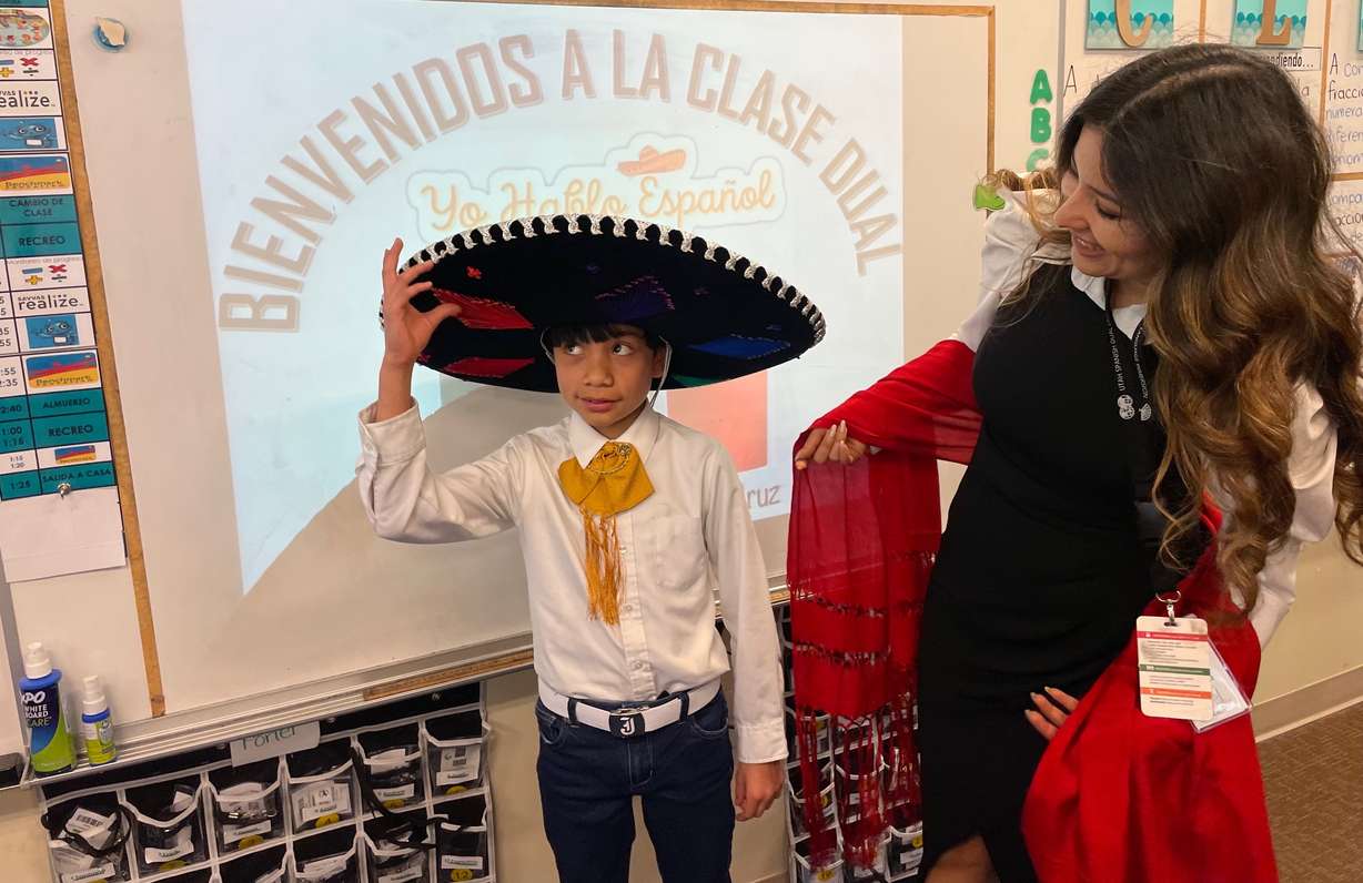 Lucia de la Cruz Rodriguez, a teacher in the Spanish-English dual-language immersion program at Midvale Elementary School in Midvale, with student Josue Arellana on Friday.