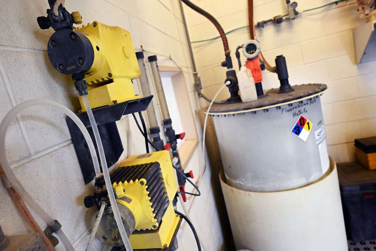 Dosing pumps inject fluoride into carrier water at one of nine Weber Basin Water Conservancy District locations in Layton on Monday.