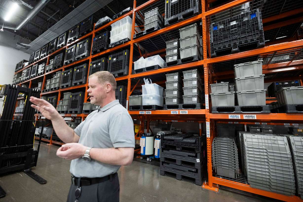 Denali Therapeutics senior warehouse manager Chester Mitchell explains the workings of his company's warehouse stocked full of materials for Denali Therapeutics' production of drugs to treat neurodegenerative diseases and lysosomal storage diseases, in Salt Lake City on March 27.