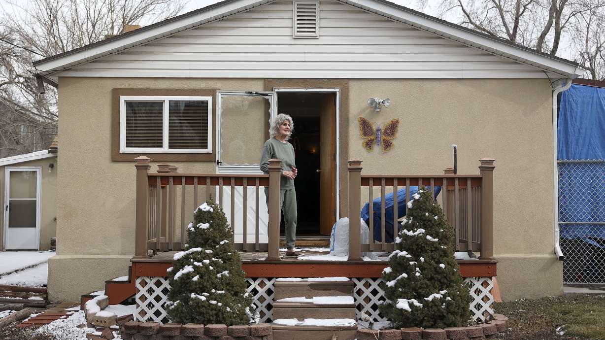 Cheryl Johnson looks out at her backyard, as she shares how much she loves it, in South Salt Lake on Feb. 24, 2022. Johnson is grateful for the Circuit Breaker property tax relief program, which helps her stay in her home as property taxes rise.