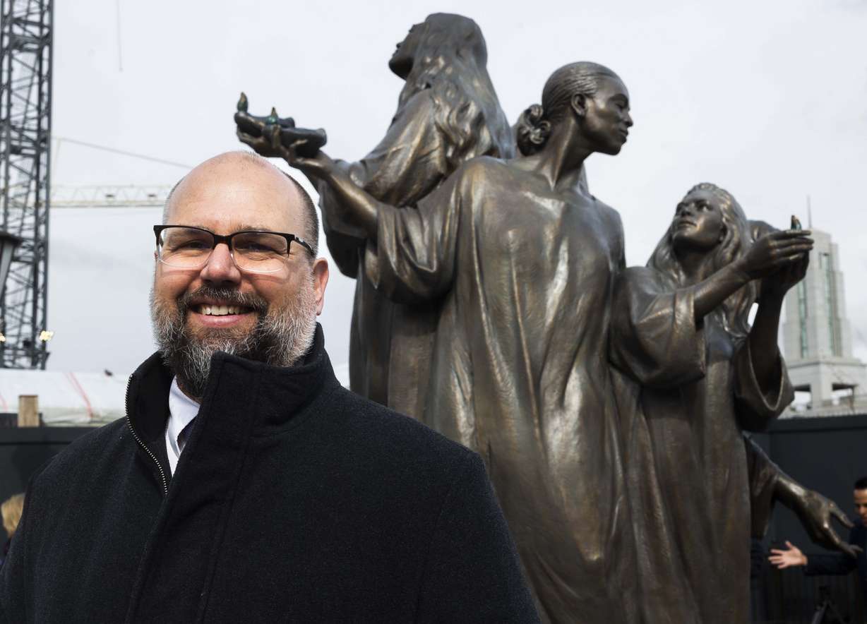 Artist Ben Hammond poses for a portrait with his sculpture, Five Wise Virgins, on Temple Square during its unveiling in Salt Lake City on Wednesday.