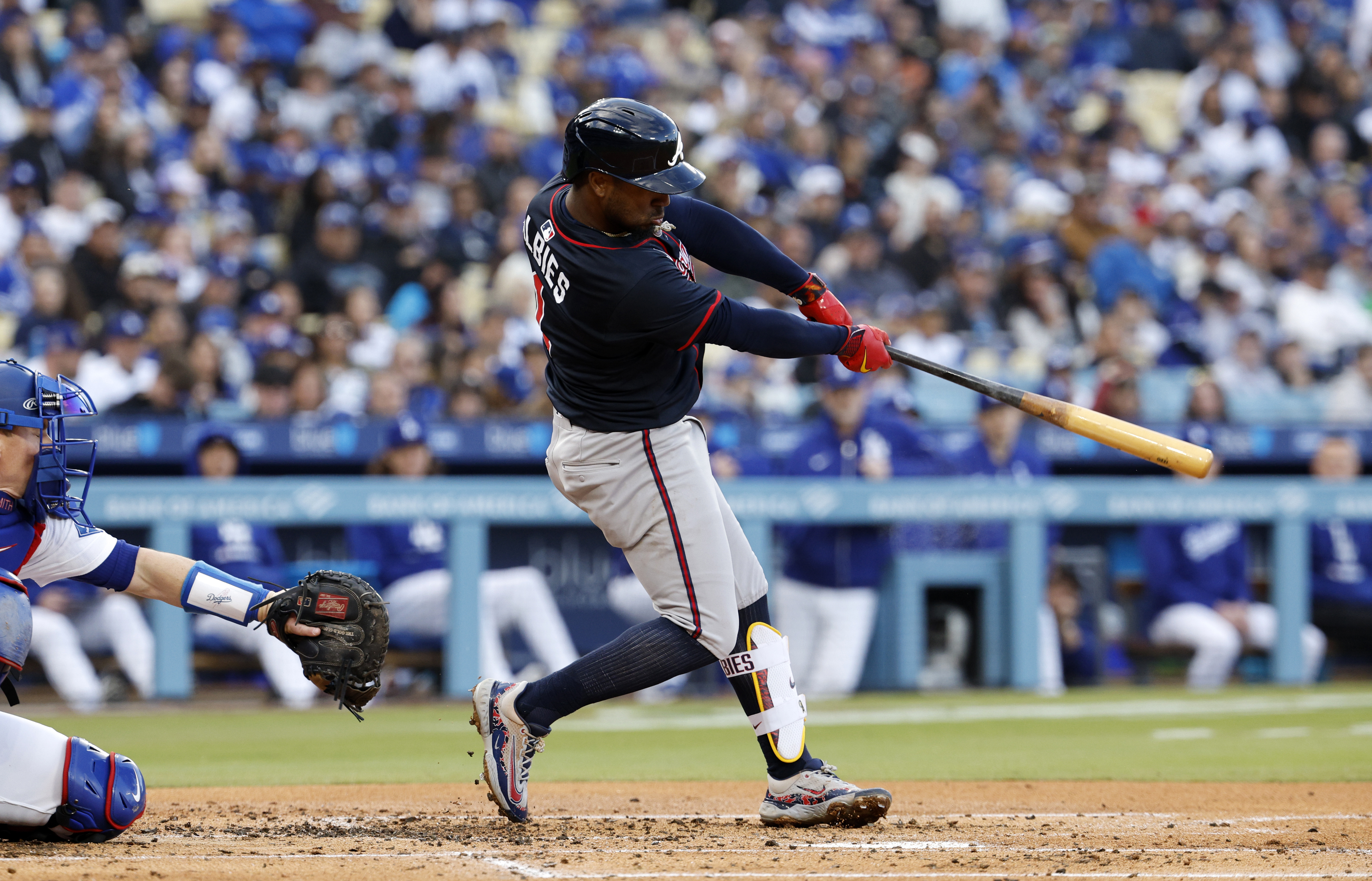 Atlanta Braves' Ozzie Albies hits a double against the Los Angeles Dodgers during the second inning of a baseball game Wednesday, April 2, 2025, in Los Angeles.