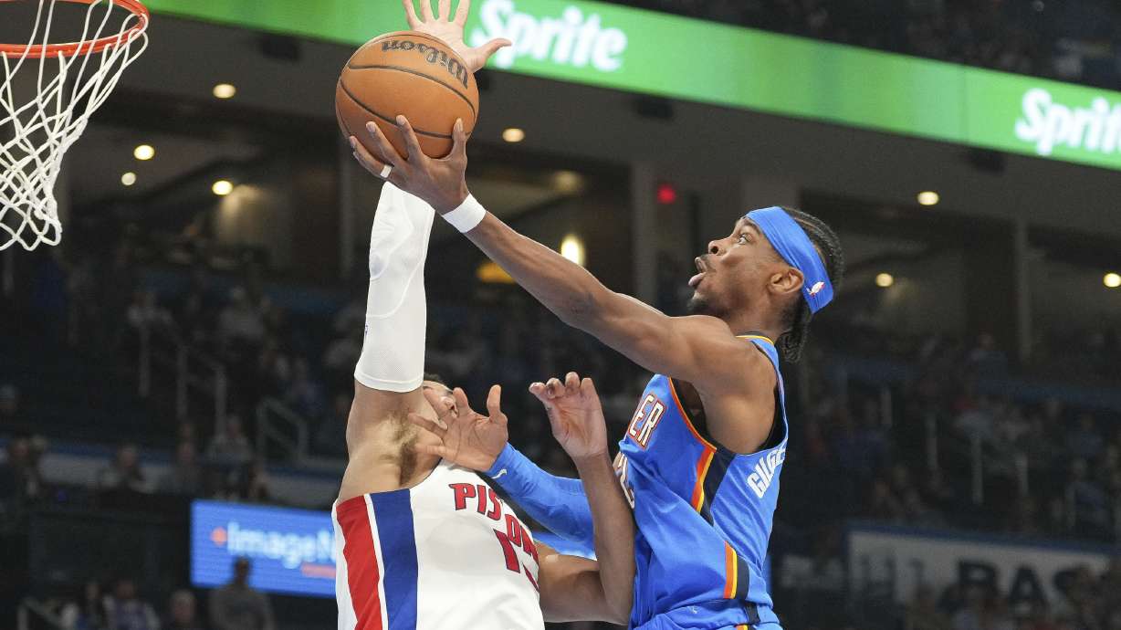 Oklahoma City Thunder guard Shai Gilgeous-Alexander, right, Detroit Pistons forward Tobias Harris, left, during the second half of an NBA basketball game, Wednesday, April 2, 2025, in Oklahoma City.