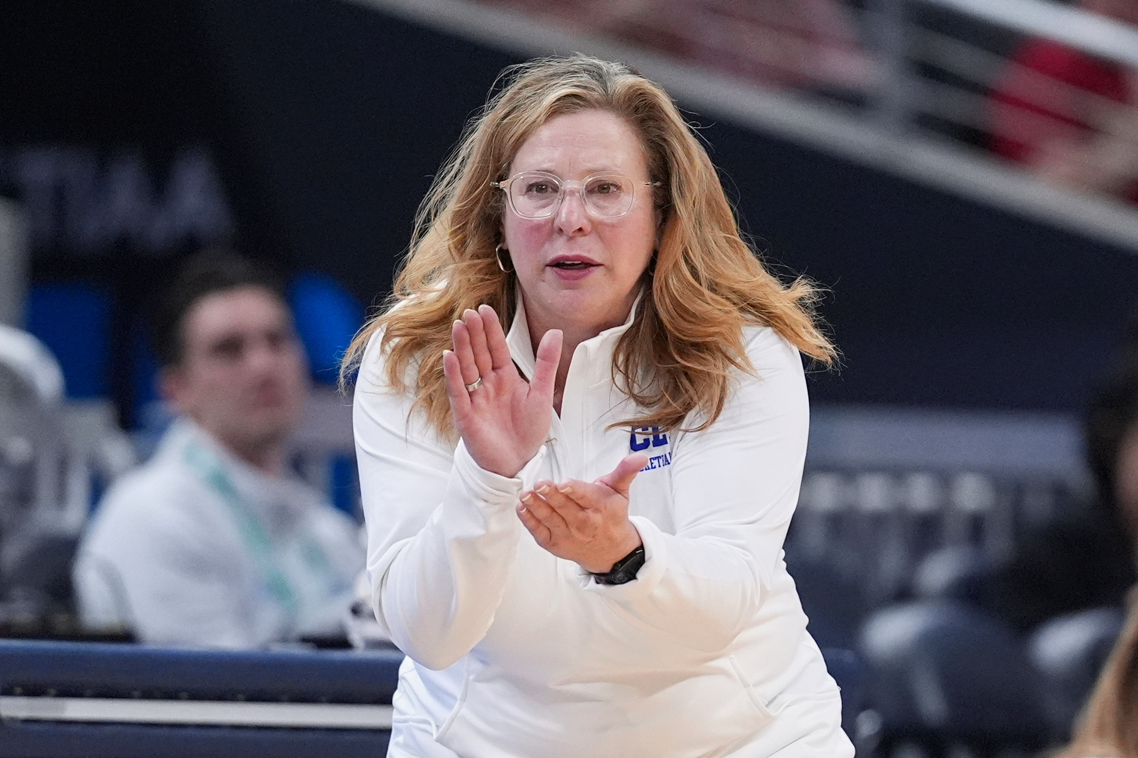 FILE - UCLA head coach Cori Close applauds her team during the second half of an NCAA college basketball game against Ohio State in the semifinals of the Big Ten Conference tournament in Indianapolis, Saturday, March 8, 2025.