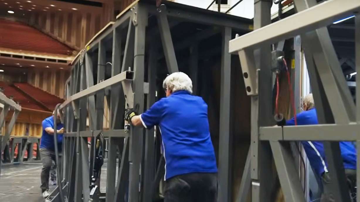 Members of the staging crew of The Church of Jesus Christ of Latter-day Saints set up the stage at the Conference Center before general conference, which takes about three weeks.