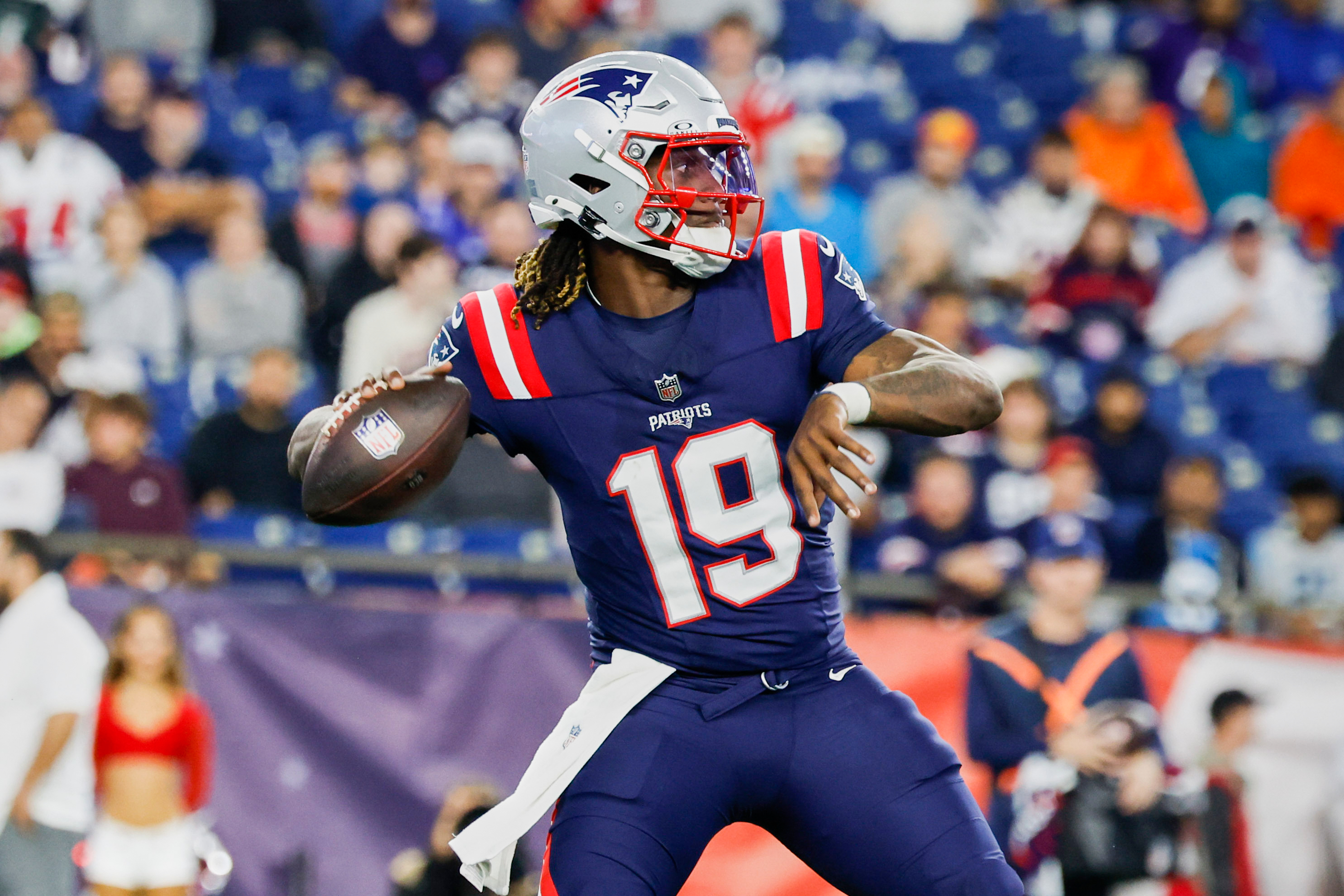 FILE - New England Patriots quarterback Joe Milton III (19) throws a pass during the second half of an NFL football game against the Carolina Panthers on Thursday, Aug. 8, 2024, in Foxborough, Mass.