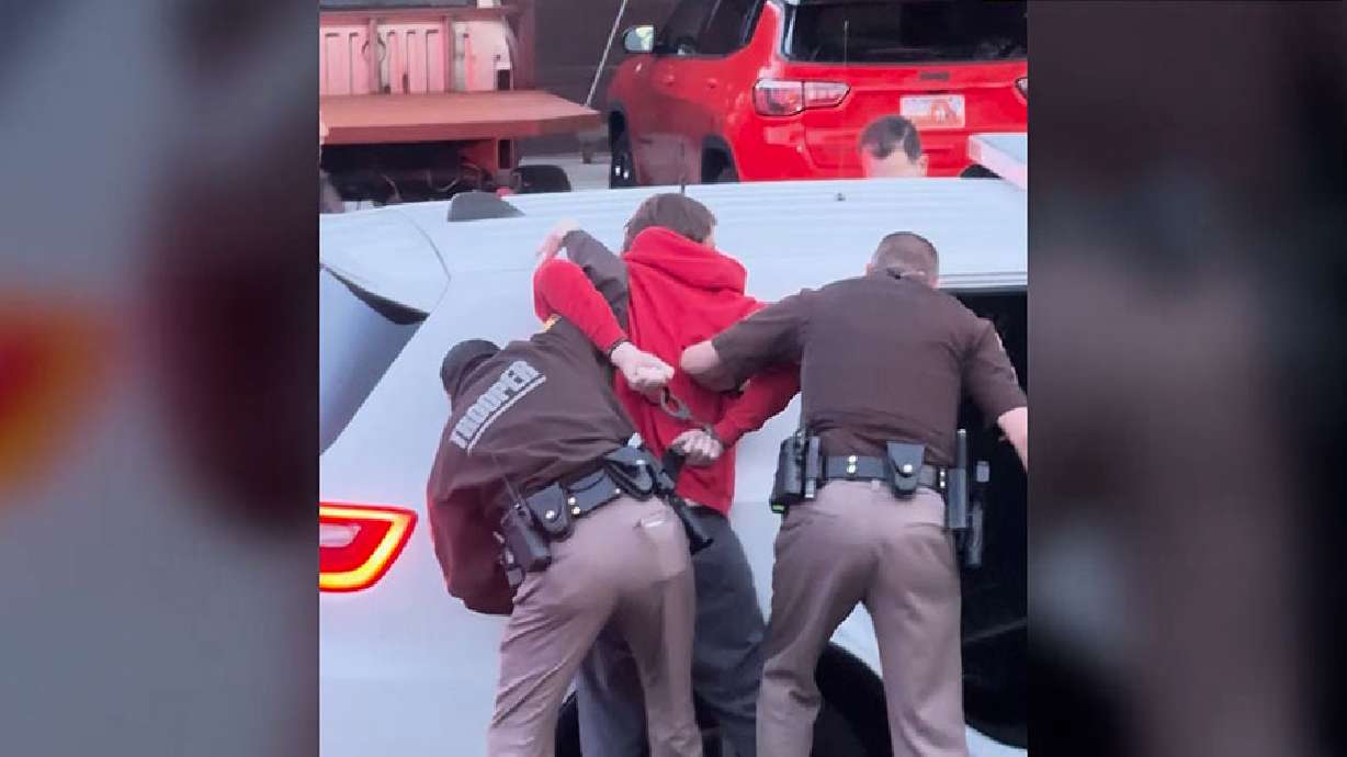 A Taylorsville man was arrested Wednesday after shots were fired near a middle school and again inside a home, and ended with an officer ramming a fleeing vehicle.