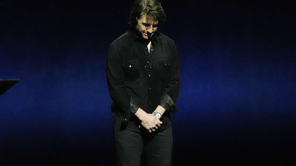 Tom Cruise, star of the upcoming film "Mission: Impossible — The Final Reckoning," leads a moment of silence for late actor Val Kilmer during the Paramount Pictures presentation at CinemaCon at Caesars Palace on Thursday in Las Vegas.