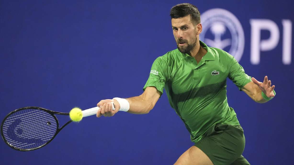 Novak Djokovic, of Serbia, plays a shot to Jakub Mensik, of Czech Republic, in the men's singles final match at the Miami Open tennis tournament, Sunday, March 30, 2025, in Miami Gardens, Fla.