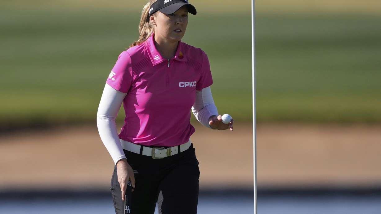Brooke Henderson, of Canada waves after her shot on the 14th green during the first round of the Ford Championship LPGA golf event, Thursday, March 27, 2025, in Phoenix.
